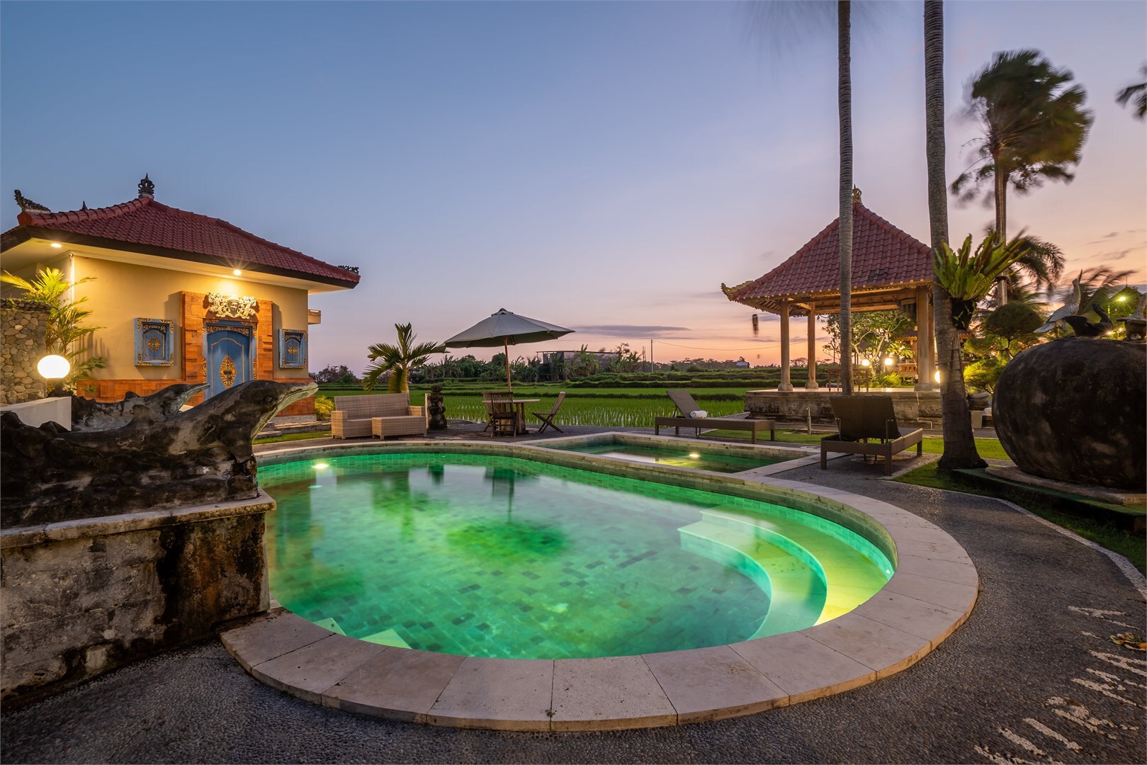 swimming pool with 2 sun loungers in Bali Vinyasa Yoga School 